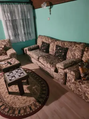 a living room with a couch and a coffee table at Vila Vera Jastrebac in Buci