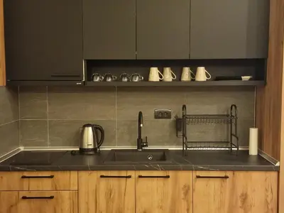 a kitchen with a sink and a counter top at SkyLux Apartments Kopaonik - Residence Hill in Kopaonik