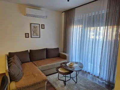 a living room with a couch and a table at Avram in Vrnjci