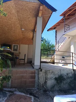 a view from the outside of a house with a patio at Vila Kruna