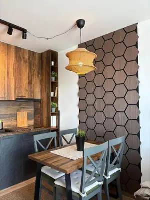 a dining room with a wooden table and chairs at Mountain Hut Kopaonik in Kopaonik