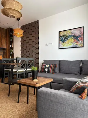 a living room with a couch and a table at Mountain Hut Kopaonik in Kopaonik