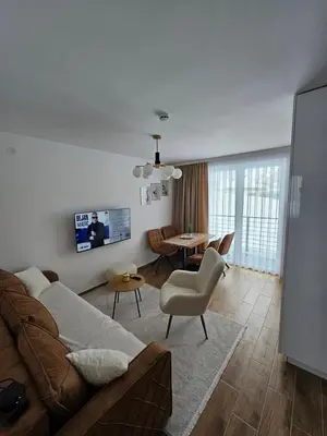 a living room with a couch and a table at Winter Tale in Kopaonik