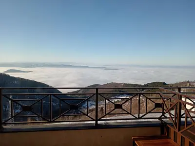 a view from the balcony of a room with a view of clouds at Pogled sa oblaka -- View from the clouds in Kopaonik