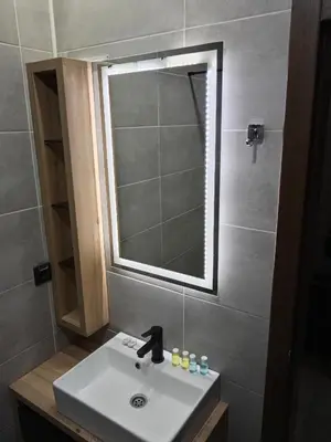 a bathroom with a sink and a mirror at Pogled sa oblaka -- View from the clouds in Kopaonik