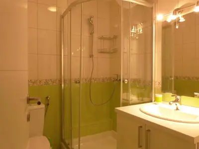 a bathroom with a shower and a sink at Apartments Sia in Kopaonik