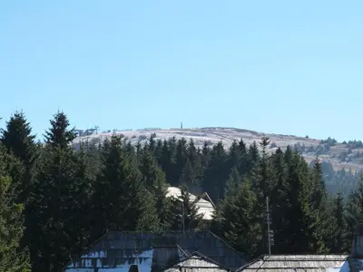 a view of the mountains from the roof of a house at Apartments Sia in Kopaonik