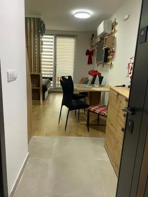 a kitchen with a desk and a chair in a room at ChiaraKop in Kopaonik