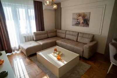 a living room with a couch and a coffee table at Nedodjija apartman in Leskovac