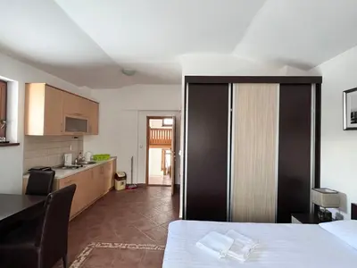 a room with a kitchen with a table and a kitchen at Vila Nina Kopaonik in Kopaonik