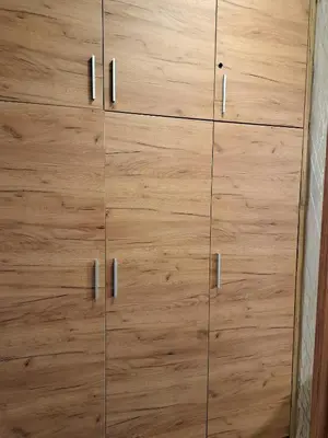 a wooden cabinet with metal doors in a room at Celestis Apartmani Konaci in Kopaonik