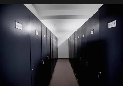 a hallway with a row of lockers in a restroom at Apartman Vidik Residence A27 Kopaonik in Kopaonik