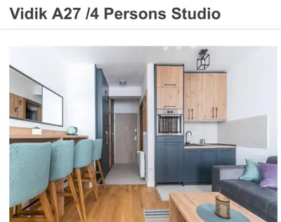 a kitchen and a living room with a table at Apartman Vidik Residence A27 Kopaonik in Kopaonik