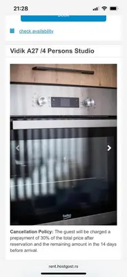 a page of a website with a microwave oven at Apartman Vidik Residence A27 Kopaonik in Kopaonik