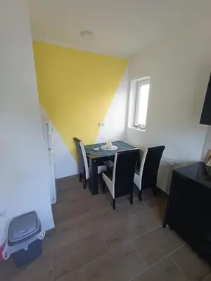 a dining room with a table and chairs at Tara in Surdulica