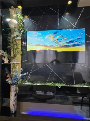 a flat screen tv sitting on top of a table at APARTMAN POSEJDON DELUXE- EXCLUSIVe in Vrnjačka Banja