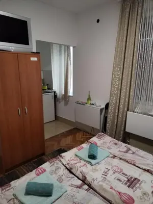 a bedroom with a bed with two towels on it at Tim in Kalna
