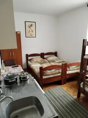 a kitchen with a sink and two bunk beds at Tim in Kalna
