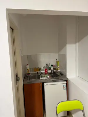 a small kitchen with a sink and a stove at Tim in Kalna