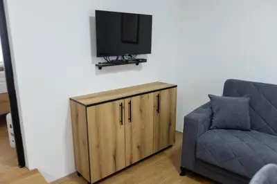 a living room with a couch and a television at Bakina kuca in Pirot