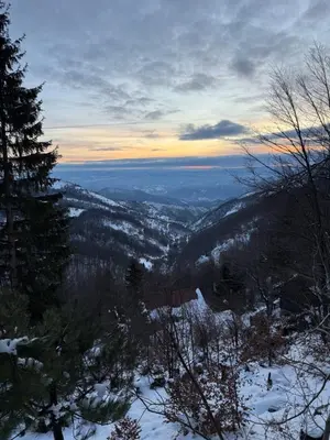 a view of a valley in the snow at sunset at Rajski Kutak Kopaonik in Kopaonik