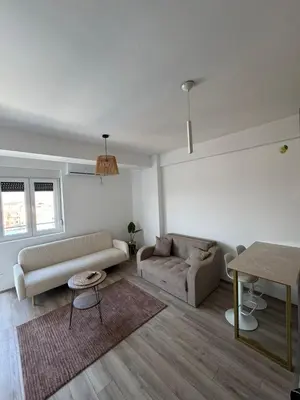 a living room with a couch and a table at Apartman Vera in Trnava