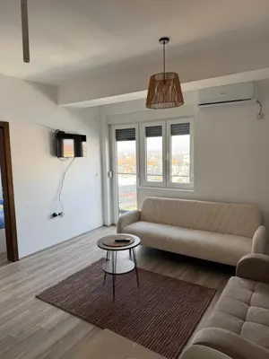 a living room with a couch and a table at Apartman Vera in Trnava