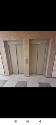 a group of three stalls in a building at Apartman Vera in Trnava