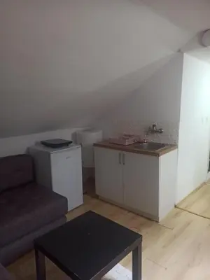 a living room with a couch and a table at Apartmani Jelena 6 in Vrnjačka Banja