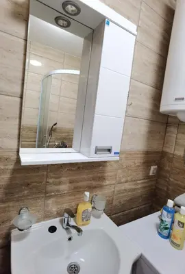 a bathroom with a sink and a mirror at Apartman Danica in Vrnjačka Banja