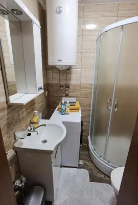 a bathroom with a sink and a shower at Apartman Danica in Vrnjačka Banja