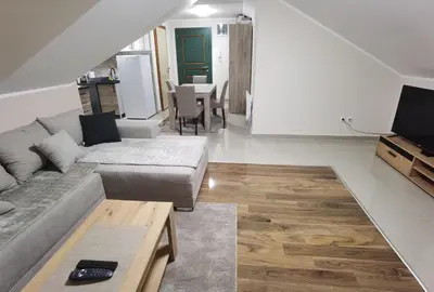 a living room with a couch and a table at Apartman Danica in Vrnjačka Banja