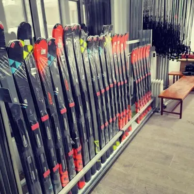 a bunch of skis are lined up in a store at The Pine Loft by Kopaonik in Kopaonik