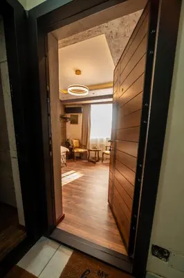 a door leading into a room with a living room at Ryo Golden Imperial 2 in Kruševac