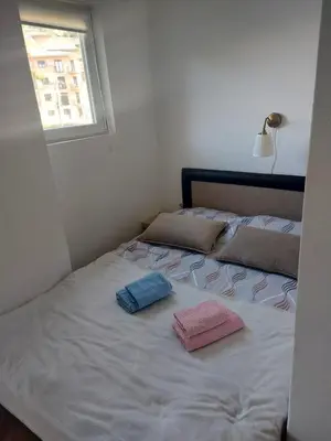 a bed with two pillows on it in a bedroom at Apartman Javor in Vrnjačka Banja
