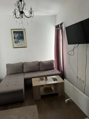 a living room with a couch and a tv at Apartman Ivana Kopaonik in Kopaonik
