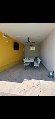 a room with a table and two chairs in it at Bazen Jelasnica 1 in Niš