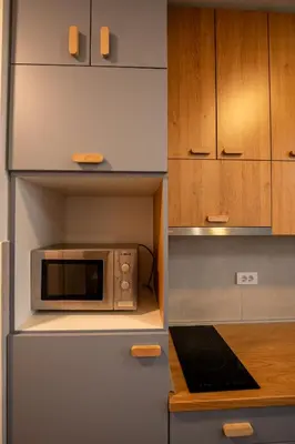 a kitchen with a microwave on a counter at Delta residence in Niš