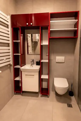 a small bathroom with a toilet and a sink at Delta residence in Niš