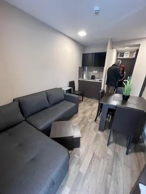 a living room with a couch and a table at Apartment in Belvedere Hills Luxury Apartments and Spa in Kopaonik