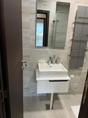 a bathroom with a white sink and a mirror at Apartment in Belvedere Hills Luxury Apartments and Spa in Kopaonik