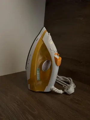 a yellow and white phone sitting on the floor at Apartmani Glamur Kopaonik in Kopaonik