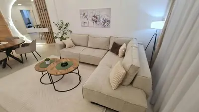 a living room with a couch and a table at Luxury Apartment Paraćin - City Center in Paraćin