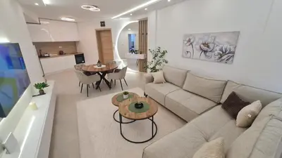 a living room with a couch and a table at Luxury Apartment Paraćin - City Center in Paraćin