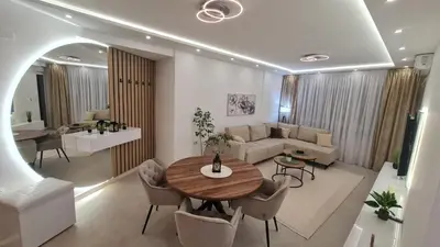 a living room with a table and a couch at Luxury Apartment Paraćin - City Center in Paraćin