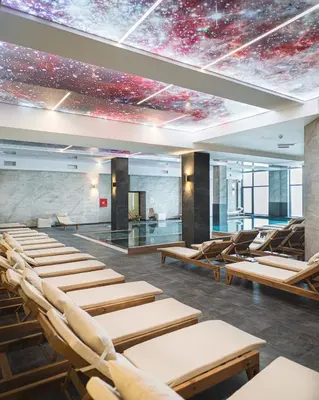 a room with chairs and a ceiling with a universe at Hill View B121, Kopaonik in Kopaonik