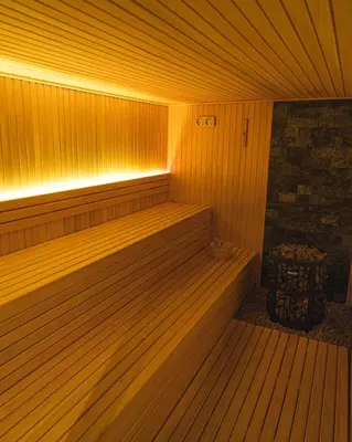 a sauna with a bench and a trash can at Hill View B121, Kopaonik in Kopaonik