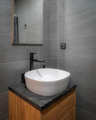 a white sink on a counter in a bathroom at Hill View B121, Kopaonik in Kopaonik