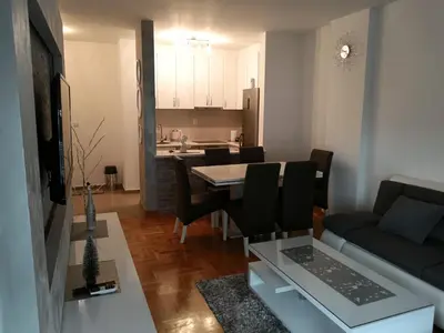 a living room with a couch and a table at Apartman Vuk in Ćuprija