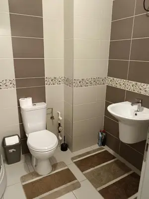 a bathroom with a toilet and a sink at Apartman Vuk in Ćuprija